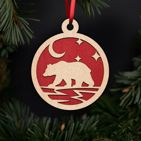 Bear ornament with moon and stars with noble fir tree