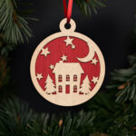 festive-cottage-with-stars-and-moon-ornament-with-noble-fir-tree