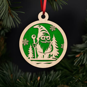 Festive gnome in snowy forest ornament with noble fir tree