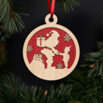 santa-giving-gift-to-child-ornament-with-noble-fir-tree